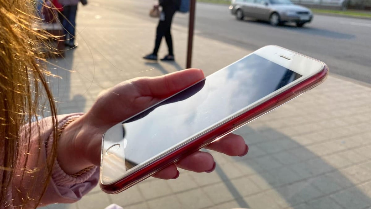A phone activating a trial eSIM next to a coverage map