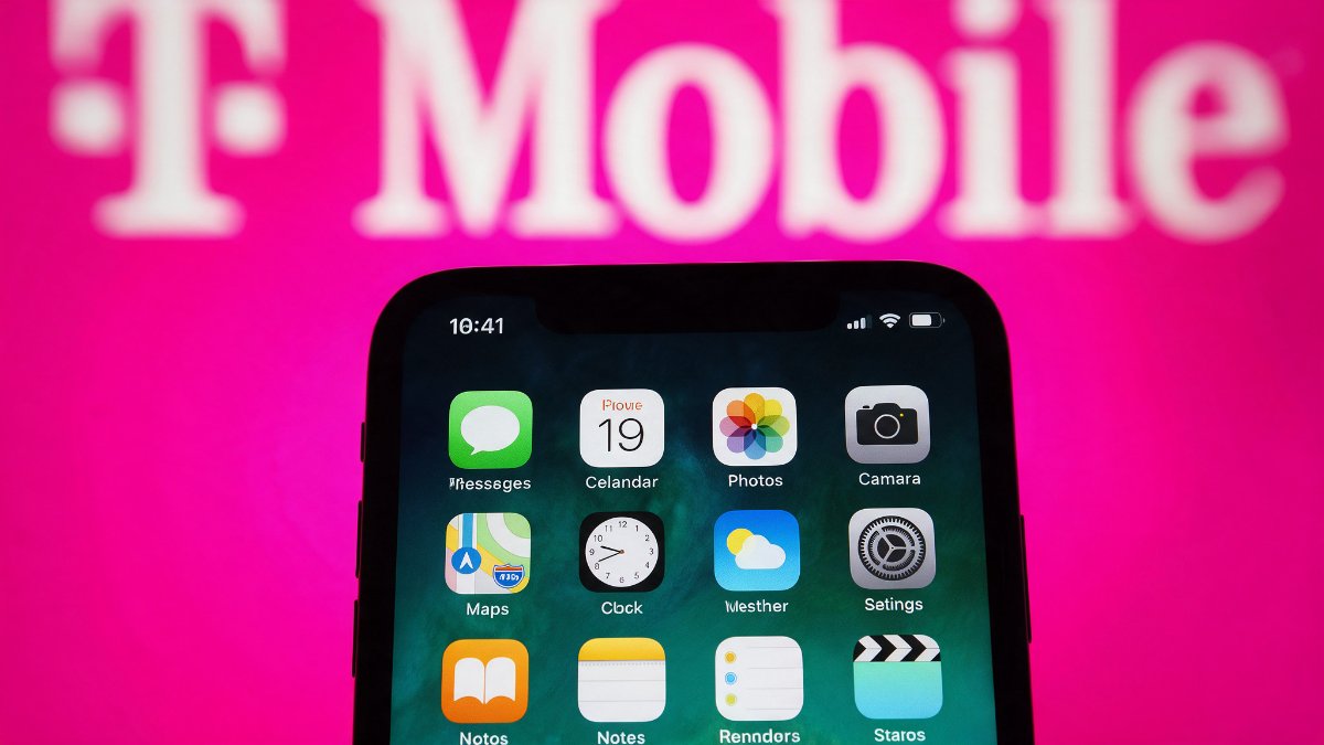 An iPhone home screen in front of a T-Mobile logo