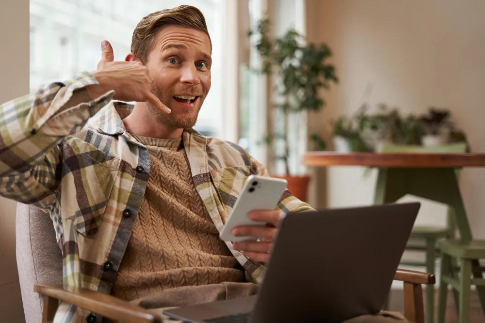 A person comparing two phone plans on a laptop